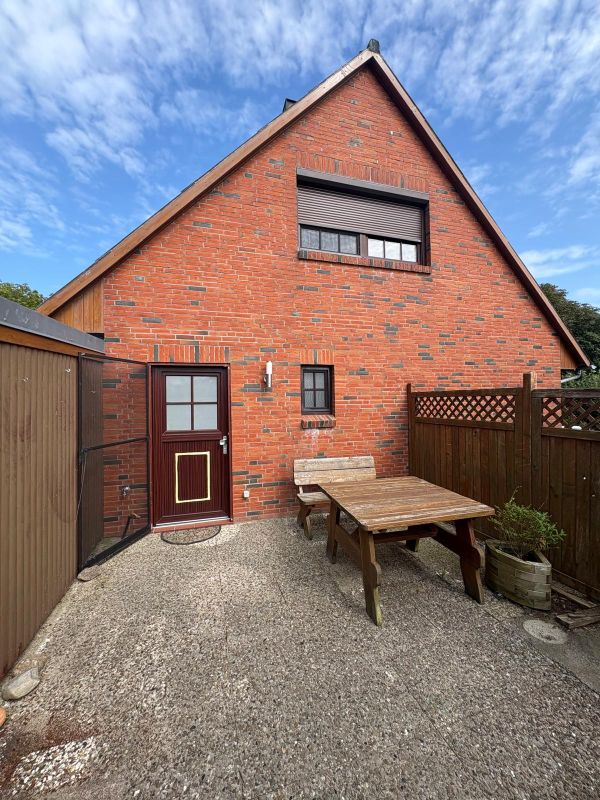 Ferienhaus in Helserdeich bei Friedrichskoog – Hinterhaus mit Terrasse